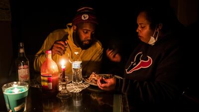 Howard and Nena Mamu eat dinner at their home in the Glenwood district in Hutto, Texas. AP