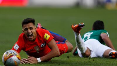 Alexis Sanchez left, in action for Chile during their 2018 World Cup qualifier against Bolivia at the Hernando Siles stadium in La Paz, Bolivia. Juan Karita / AP Photo