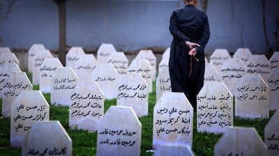An Iraqi Kurd man visit at a grave yard and a monument for the victims who were killed in a gas attack by former Iraqi president Saddam Hussein.