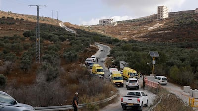 Security personnel and ambulances arrive at the site of the attack near a Palestinian village. AFP