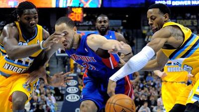Denver Nuggets' Andre Iguodala, right, steals the ball from Tayshaun Prince of the Detroit Pistons during their NBA game.