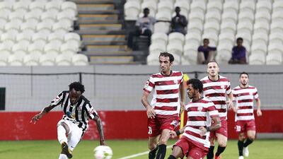 Al Jazira’s Jonathan Pitroipa, left, takes on the Fujairah defenders, but his teammates in defence let the team down. Jeffrey E Biteng / The National