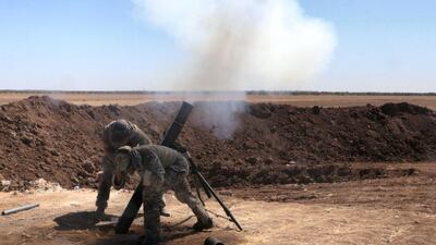 A file photo of Free Syrian Army (FSA) members launching a rocket attack on September 26, 2016. Getty Images