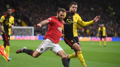 Manchester United midfielder Juan Mata vies with Watford's Spanish defender Kiko Femenia. AFP