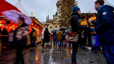 People visit a Christmas market in the Gendarmenmarkt ahead of the holiday season in Berlin. AFP