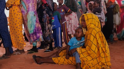 Refugees fleeing fighting in Darfur queue at the Sudan-Chad border. Getty Images