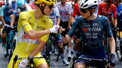 UAE Team Emirates' Tadej Pogacar with Team Visma-Lease a Bike's Jonas Vingegaard before the start of Stage 12. Reuters