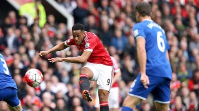 Manchester United's Anthony Martial, centre, makes a shot on goal, during their English Premier League match against Everton, at Old Trafford, in Manchester, England, Sunday April 3, 2016. Martin Rickett/PA
