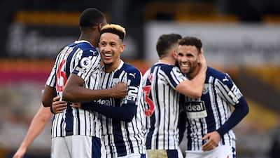 West Bromwich Albion players celebrate after the final whistle. PA