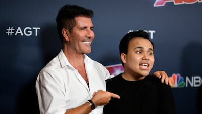 'America's Got Talent' judge Simon Cowell with the 2019 winner Kodi Lee. AFP