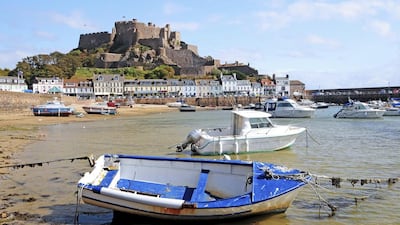 Gorey Harbour and Mont Orgueil Castle, Jersey. The 13th-century castle is part of the Channel Islands’ historic architecture. Getty Images