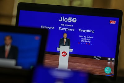 Mukesh Ambani, chairman and managing director of Reliance Industries, speaks via live stream during the company's annual general meeting last month in Mumbai. Bloomberg