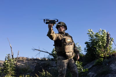 A Ukrainian serviceman known as "Beha" of "Code 9. 2" launches a drone before flying over Russian positions at the frontline near Klishchiivka, Donetsk region, Ukraine, Sunday, Sept. 24, 2023. (AP Photo/Alex Babenko).