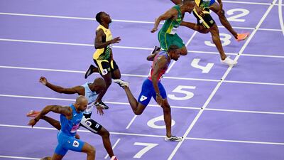 Noah Lyles, centre, of the USA wins the Men 100m final. EPA