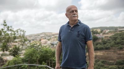 Retired brigadier general Amal As'ad walks near his home in Isfiya, a Druze-majority town in northern Israel in the region of Mount Carmel. Heidi Levine for The National