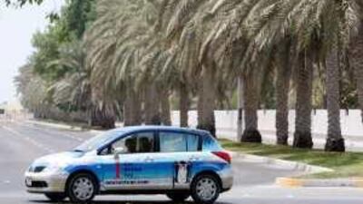 A Dh1-per-day One Rent Car rental vehicle is driven around Abu Dhabi in August.