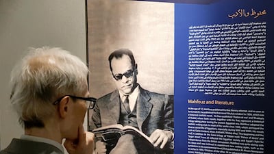 A visitor reads the biography of Mahfouz after the official opening of the museum. Reuters