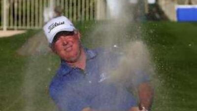 Mark O'Meara plays a shot out of a bunker during the Dubai Desert Classic Charity match at Emirates Golf Club in January.