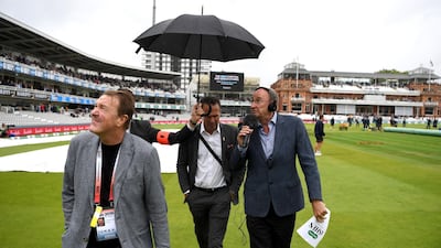 Test Match Special commentators Phil Tufnell, Michael Vaughan and Jonathan Agnew avoid the rain during day one of the 2nd Specsavers Ashes Test match at Lord's Cricket Ground in London, England. Getty Images