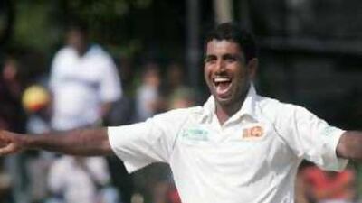 Sri Lanka's Dammika Prasad accounts for the dangerous Virender Sehwag, which started the slide for the Indians. He also scored a valuable 36 for the home team.