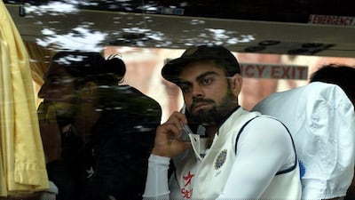 India captain Virat Kohli sits on the team bus after rain led to a draw of the second Test against South Africa. Manjunath / AFP