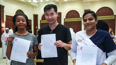 Volunteers Netty Mdluli and Shun Yat Fok both from Amana Healthcare with Aswathy Vijayakumar from Medeor Hospital