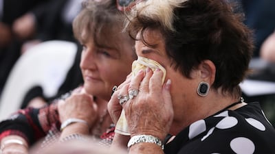 A family member sheds tears during the national memorial service. Getty Images