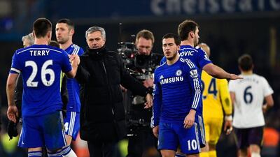 John Terry of Chelsea shakes hands with manager Jose Mourinho after their Premier League win over Everton on Wednesday night. Mike Hewitt / Getty Images / February 11, 2015