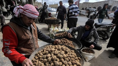 Merchants present their desert truffles at a market in the city of Hama in west-central Syria. AFP