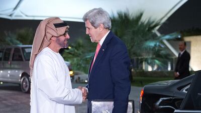 The US secretary of state, John Kerry, is greeted by Sheikh Mohammed bin Zayed , Crown Prince of Abu Dhabi and Deputy Supreme Commander of the Armed Forces at the Mena Palace on Monday. Evan Vucci / AP Photo