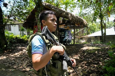Police check on abandoned homes inside the government declared permanent danger zone surrounding Mayon volcano at Calbayog village on June 15. AP