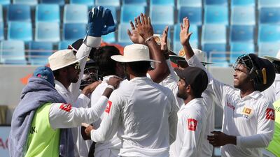 Sri Lanka cricket players celebrate after winning the second Test against Pakistan in Dubai. Karim Sahib / AFP