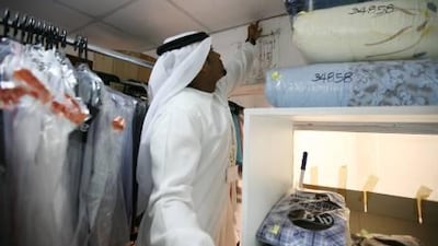 The inspector Obaid Al Zaabi from Abu Dhabi Municipality public health department is checking Abu Dhabi groceries, laundries, tailors and salons with his checklist to make sure that the shops are meeting with the municipality requirements for the health and public safety.