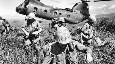 U.S. Marines leave a helicopter to search the hills near a former U.S. base at Khe Sanh in South Vietnam in Oct. 1968 during the Vietnam War. AP Photo