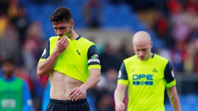 Huddersfield Town's Christopher Schindler and Aaron Mooy look dejected after being relegated from the Premier League. The Terriers fate was sealed in March. Reuters