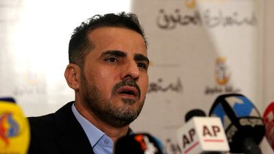Hussein Munis gives a press conference to announce his party's electoral programme for the upcoming elections. AFP