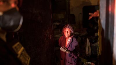 A woman argues with a policeman during an operation to enforce the curfew in El Callao, on the outskirts of Lima, Peru. AP Photo