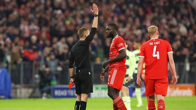 Referee Clement Turpin withdraws the red card shown to Bayern's Dayot Upamecano after a VAR review ruled there was an offside before he committed a foul on Erling Haaland. Getty
