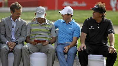 Pablo Larrazabal (green) with Rory McIlroy (blue) and Phil Mickelson (black) at the trophy ceremony on Sunday. Kamran Jebreili / AP