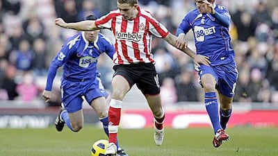 Jordan Henderson, with ball, will play alongside Steven Gerrard in the Liverpool midfield next season.