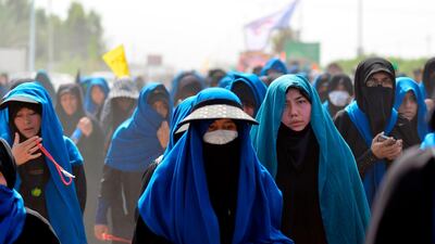 Shiite Muslim pilgrims pass through the holy Iraqi city of Najaf on their way to the central shrine city of Karbala ahead of the Arbaeen religious festival. AFP