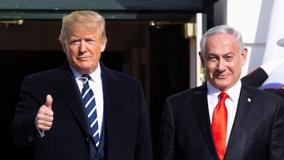US President Donald Trump (left) gestures while greeting Prime Minister of Israel Benjamin Netanyahu (right) upon his arrival at the South Portico of the White House, in Washington. EPA