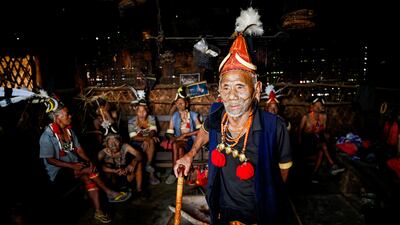 Bo Wang, centre, the king of Hongphoi village