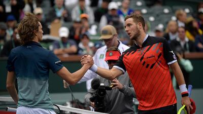 Jan-Lennard Struff, right, shakes hands with Alexander Zverev after their match at Indian Wells. AP