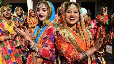 School girls perform Punjabi folk dance 'Giddha' ahead of the upcoming 'Lohri' festival at a government school in Amritsar on January 8, 2025. (Photo by Narinder NANU / AFP)