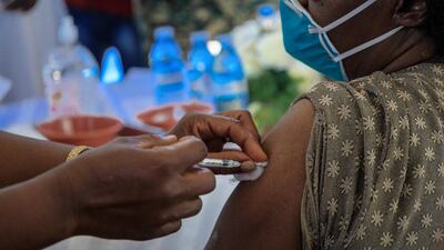 An Ugandan doctor receives the first injection of the Oxford/AstraZeneca Covid-19 vaccine at Mulago referral hospital in Kampala. AFP