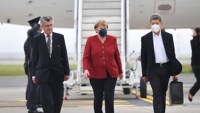 Chancellor of Germany Angela Merkel arrives at Cornwall Airport in Newquay, England, Friday June 11, 2021, ahead of the G7 summit. Leaders of the G7 begin their first of three days of meetings on Friday in Carbis Bay, in which they will discuss COVID-19, climate, foreign policy and the economy. (Stefan Rousseau/Pool via AP)