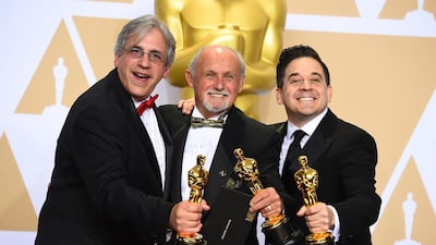 Mark Weingarten, from left, Gregg Landaker, and Gary Rizzo, winners of the award for best sound mixing for "Dunkirk", pose in the press room at the Oscars. Jordan Strauss / Invision /AP