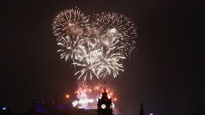 Fireworks light up the sky over Edinburgh Castle and the Balmoral Hotel Clock to mark the New Year, in Edinburgh, Scotland, on January 1, 2023. Reuters