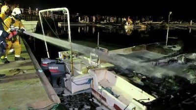 A boat exploded and set fire to other fishing boats in Al Rams Harbour on Tuesday evening. Handout photo - Courtesy RAK Police